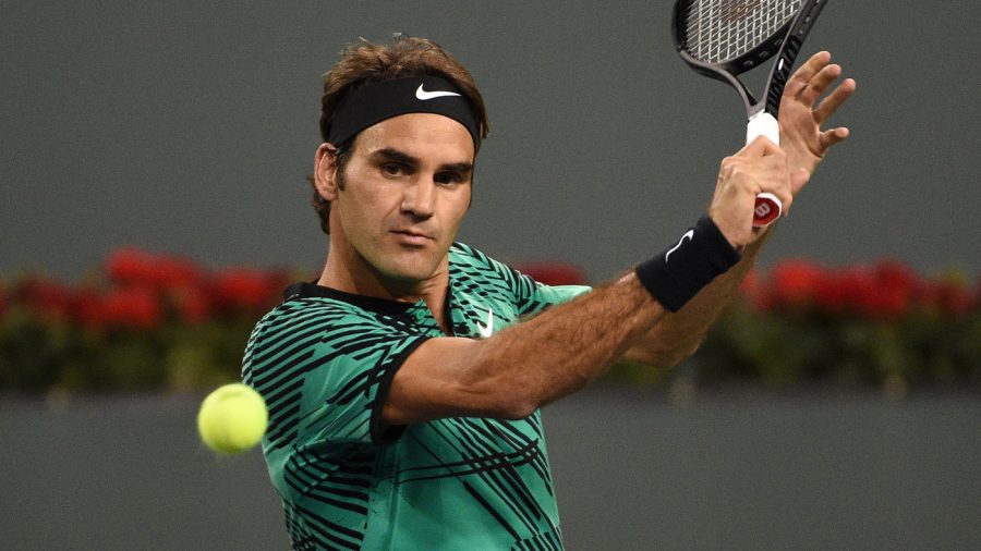 INDIANS WELLS, CA - MARCH 12: Roger Federer of Switzerland hits a backhand against Stephane Robert of France at the BNP Paribas Open at Indian Wells Tennis Garden on March 12, 2017 in Indian Wells, California. (Photo by Kevork Djansezian/Getty Images)