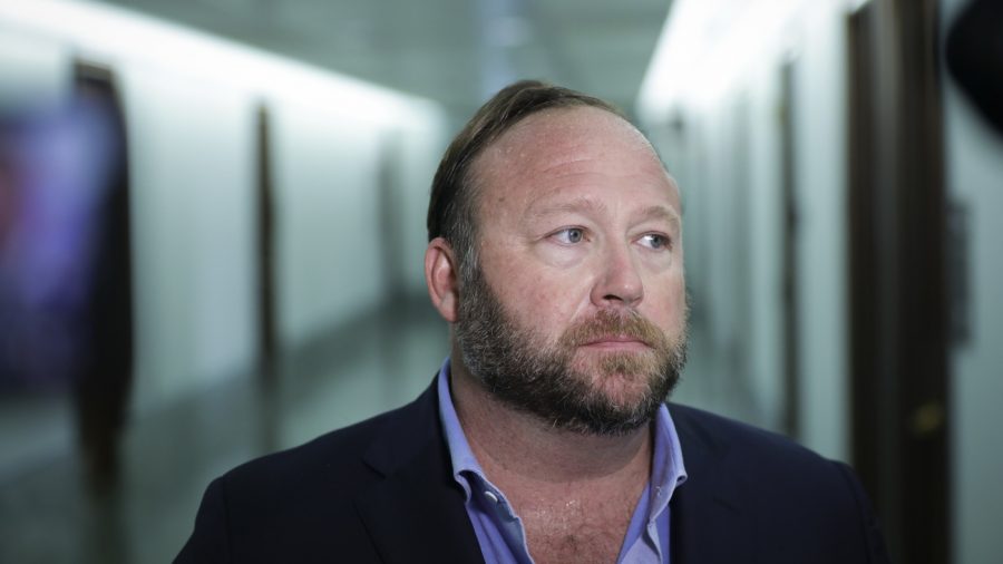 WASHINGTON, DC - SEPTEMBER 5: Alex Jones of InfoWars talks to reporters outside a Senate Intelligence Committee hearing concerning foreign influence operations' use of social media platforms, on Capitol Hill, September 5, 2018 in Washington, DC. Twitter CEO Jack Dorsey and Facebook chief operating officer Sheryl Sandberg faced questions about how foreign operatives use their platforms in attempts to influence and manipulate public opinion. (Photo by Drew Angerer/Getty Images)