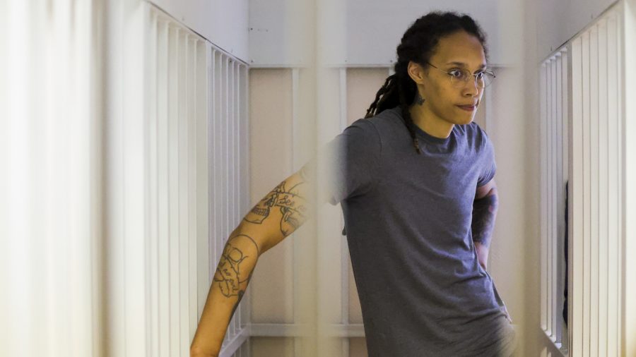 WNBA star and two-time Olympic gold medalist Brittney Griner, stands listening to a verdict in a courtroom in Khimki just outside Moscow, Russia, Thursday, Aug. 4, 2022. American basketball star Brittney Griner apologized to her family and teams as a Russian court heard closing arguments in her drug possession trial said it expected to deliver a verdict later Thursday. (Evgenia Novozhenina/Pool Photo via AP)